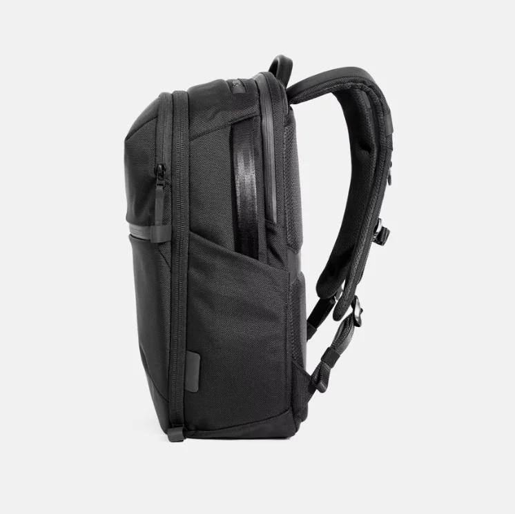 Side profile view waterproof polyester laptop travel backpack, padded adjustable shoulder straps for office and travel use